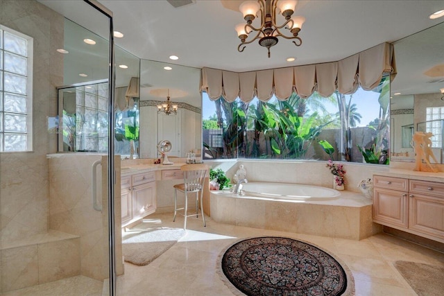 bathroom with separate shower and tub, plenty of natural light, and a notable chandelier