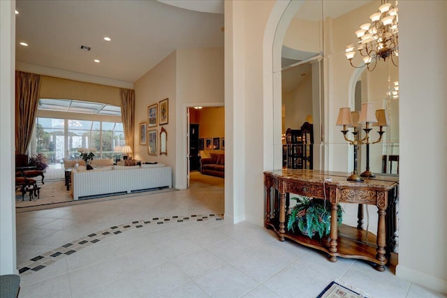 foyer entrance featuring tile patterned floors and a chandelier