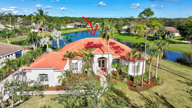 birds eye view of property with a water view