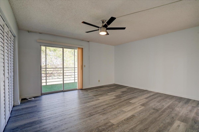 spare room featuring hardwood / wood-style floors, ceiling fan, and a textured ceiling