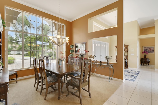 tiled dining space featuring a notable chandelier and crown molding