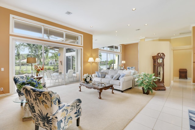 living room featuring light carpet and crown molding