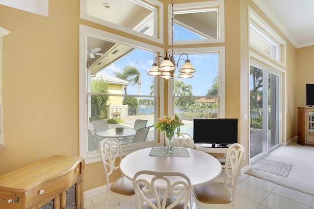 sunroom / solarium with lofted ceiling and a notable chandelier