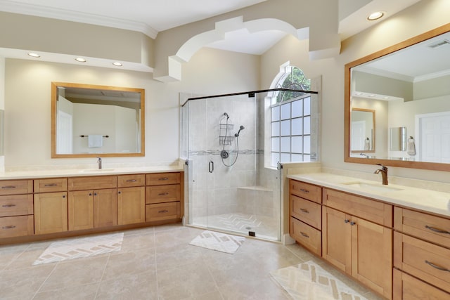 bathroom featuring ornamental molding, an enclosed shower, and vanity