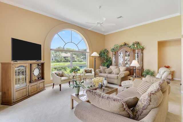 living room featuring light carpet, ornamental molding, and ceiling fan