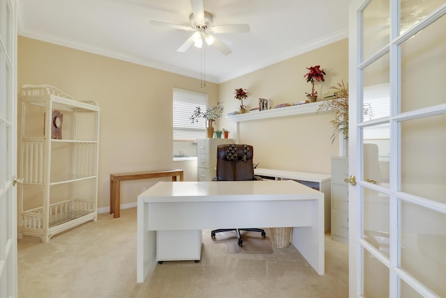 carpeted home office featuring ceiling fan and ornamental molding