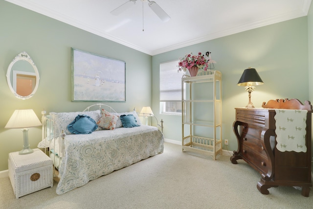 bedroom with crown molding, carpet flooring, and ceiling fan