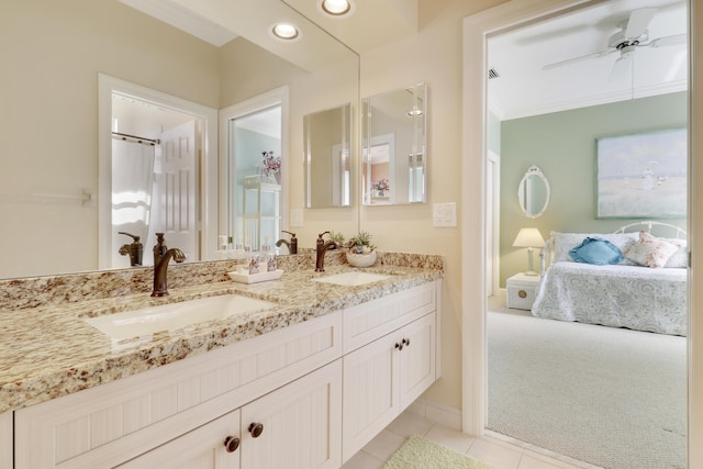 bathroom with ceiling fan, ornamental molding, tile patterned floors, and vanity