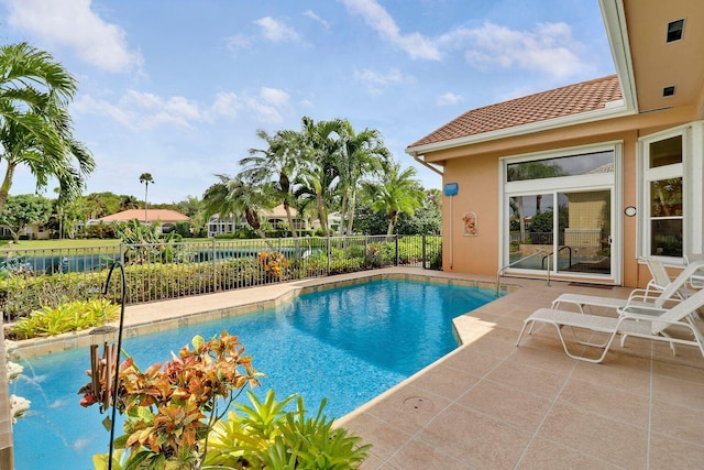 view of swimming pool featuring a patio area