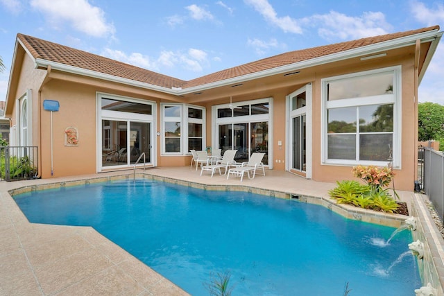 back of house with a patio area and pool water feature