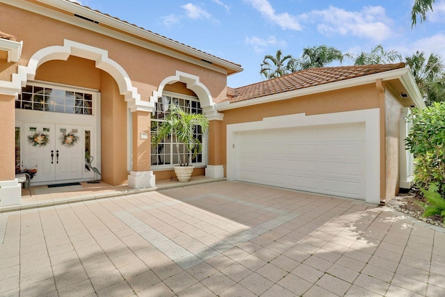 mediterranean / spanish-style home with a garage