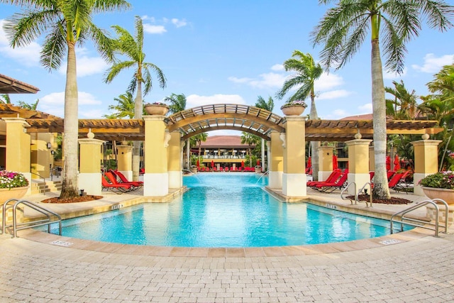 view of swimming pool featuring a pergola