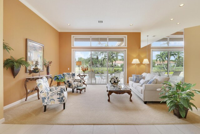 living room with crown molding and light tile patterned floors