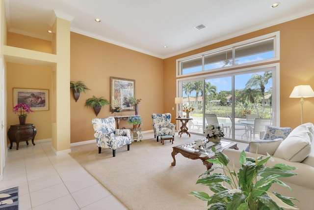 living room with ornamental molding and light tile patterned floors