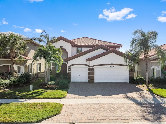 mediterranean / spanish-style home featuring a garage