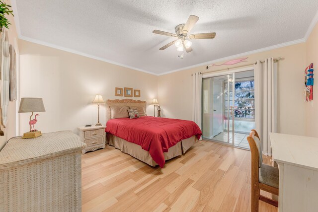 2600 SE Ocean Unit M14, Stuart, FL 34996 - bedroom with access to exterior, light wood-style flooring, ornamental molding, a textured ceiling, and ceiling fan