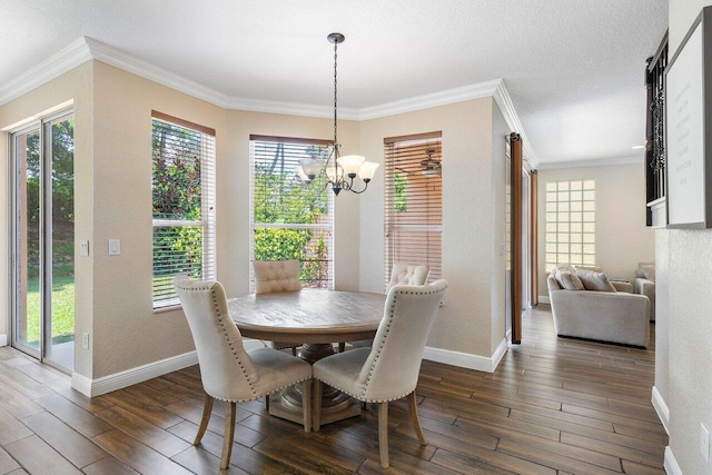 dining space with crown molding, dark wood-type flooring, and an inviting chandelier