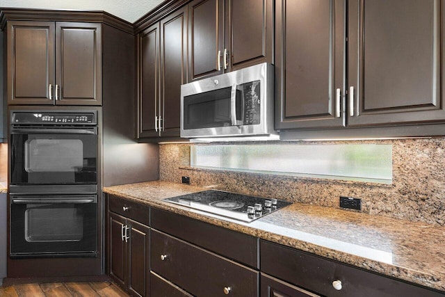 kitchen featuring hardwood / wood-style flooring, black double oven, dark brown cabinets, and white stovetop