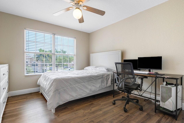 bedroom with dark hardwood / wood-style flooring, multiple windows, and ceiling fan