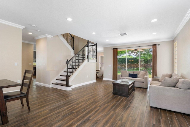 living room featuring a textured ceiling, dark hardwood / wood-style floors, and ornamental molding