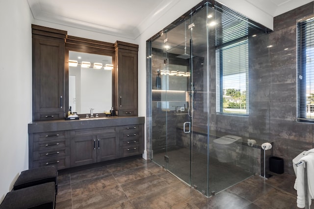 bathroom with vanity, crown molding, toilet, tile walls, and an enclosed shower