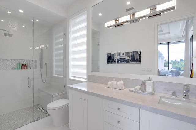 bathroom featuring tile patterned floors, a shower with door, vanity, and toilet