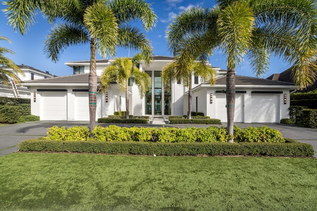 view of front facade with a garage and a front yard