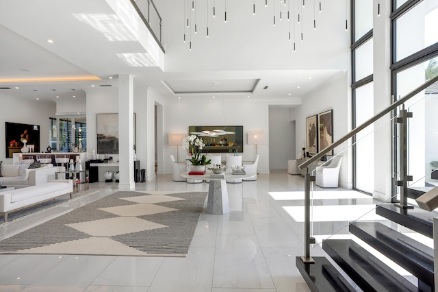 foyer entrance with a towering ceiling