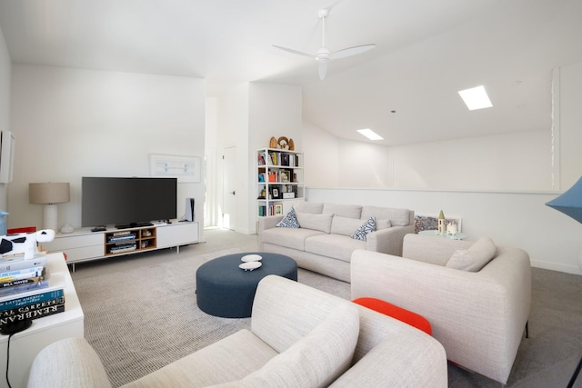 living room with carpet, vaulted ceiling, and ceiling fan