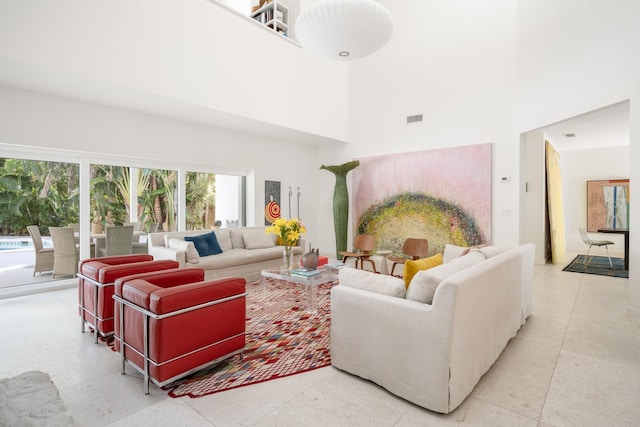 living room with a high ceiling