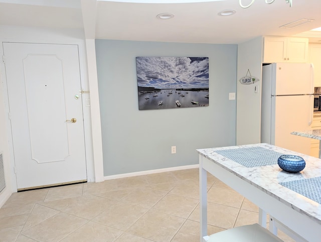 interior space featuring light tile patterned floors