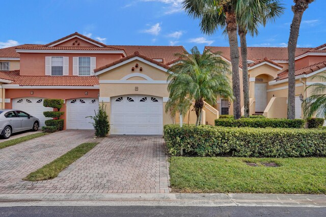 mediterranean / spanish house featuring a garage