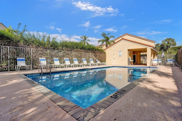 view of swimming pool with a patio area