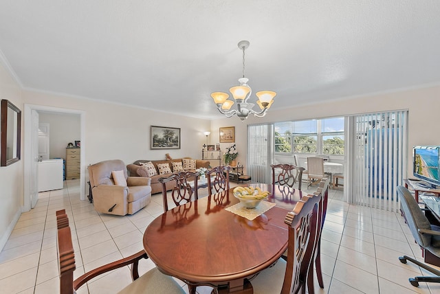 dining room with crown molding, a notable chandelier, and light tile patterned floors