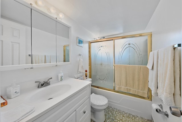 full bathroom with vanity, enclosed tub / shower combo, and toilet