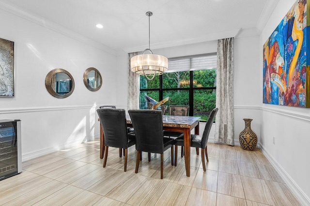 dining room with light hardwood / wood-style floors, crown molding, beverage cooler, and a notable chandelier