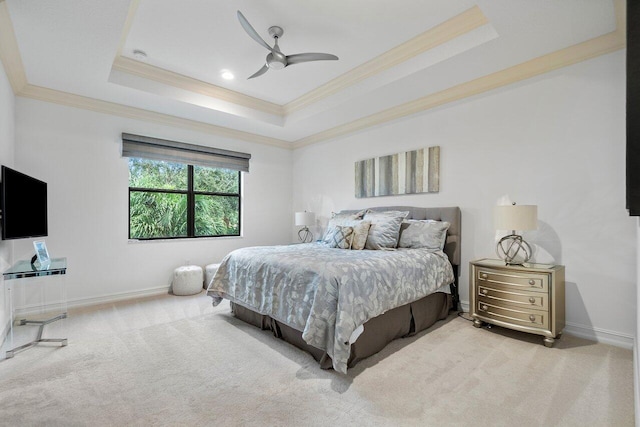 bedroom with light colored carpet, a raised ceiling, ceiling fan, and crown molding