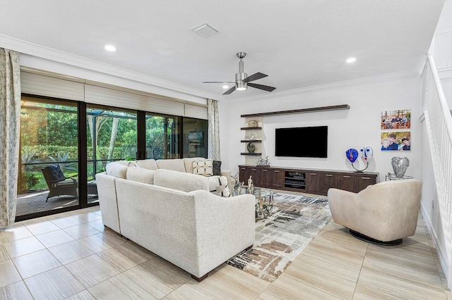 living room with a textured ceiling, ceiling fan, light tile patterned floors, and crown molding