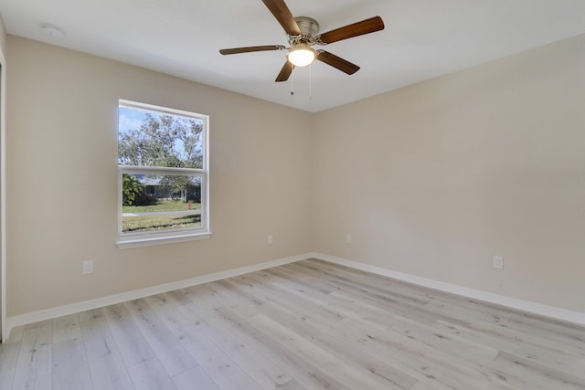 empty room with light hardwood / wood-style flooring and ceiling fan