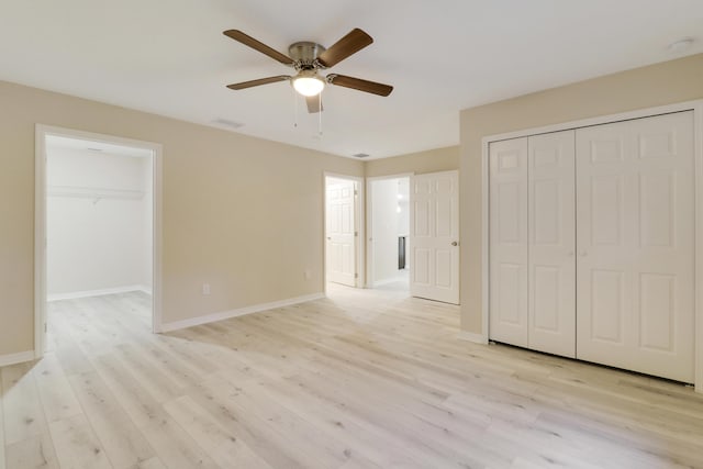 unfurnished bedroom featuring ceiling fan and light hardwood / wood-style flooring