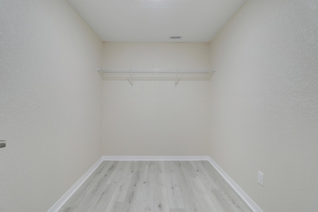 walk in closet featuring light wood-type flooring