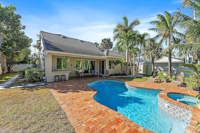 view of swimming pool featuring a patio area, an in ground hot tub, and ceiling fan