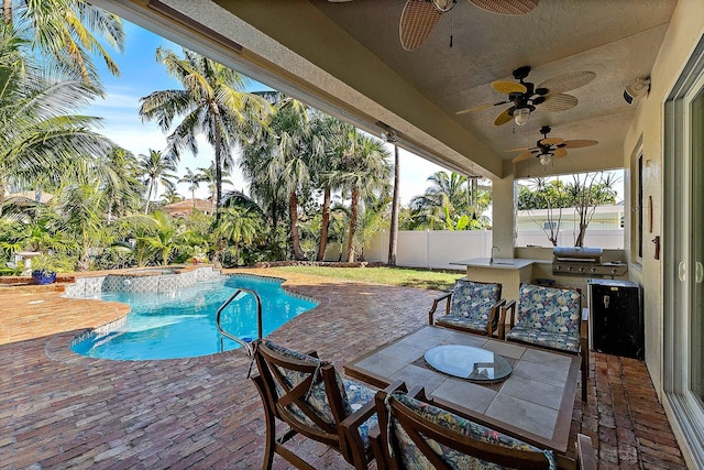 view of swimming pool with an in ground hot tub, a patio, ceiling fan, and a grill