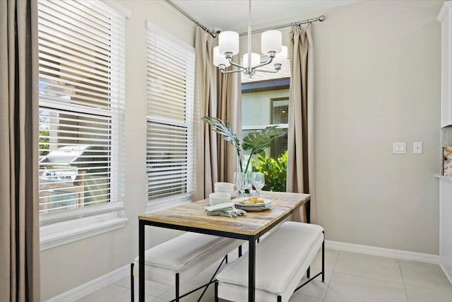 dining space featuring a chandelier and light tile patterned flooring