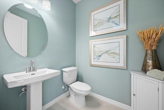 11966 SW Macelli Way, Port Saint Lucie, FL 34987 - bathroom featuring toilet, baseboards, and tile patterned floors