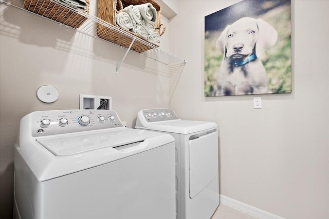 11966 SW Macelli Way, Port Saint Lucie, FL 34987 - laundry area featuring separate washer and dryer and baseboards