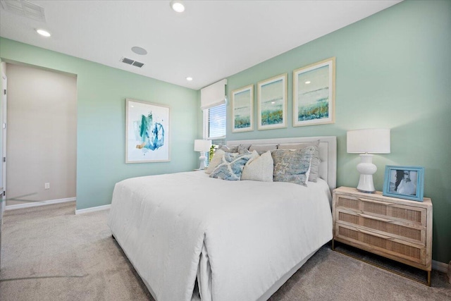 bedroom with light colored carpet