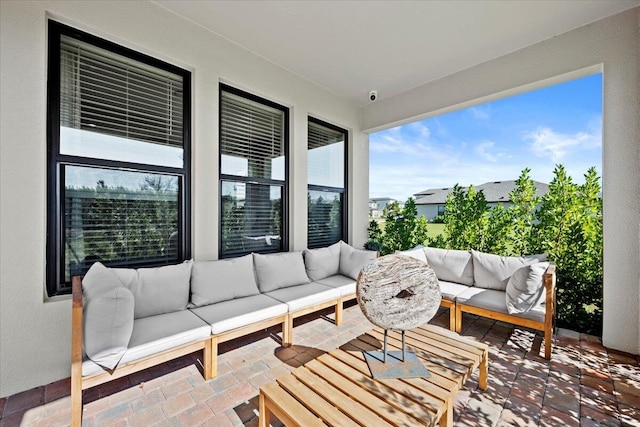 balcony with outdoor lounge area and a patio