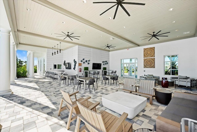 11966 SW Macelli Way, Port Saint Lucie, FL 34987 - view of patio featuring a ceiling fan, outdoor dining space, and outdoor lounge area