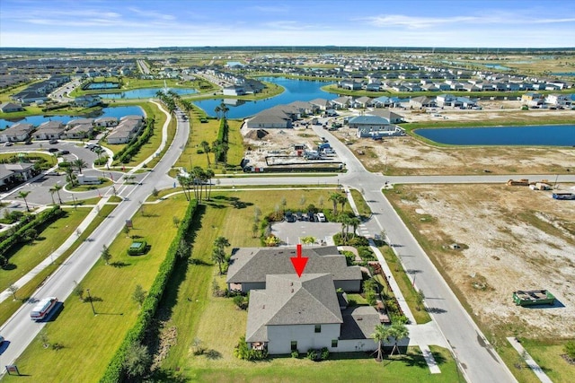 birds eye view of property featuring a water view